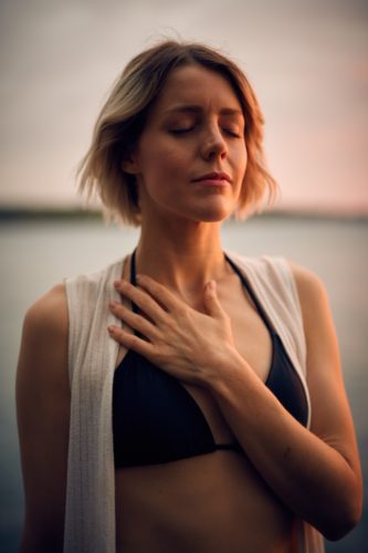 Married & Lonely - Image shows woman with eyes closed and resting left hand on her chest - Alicia Munoz blog